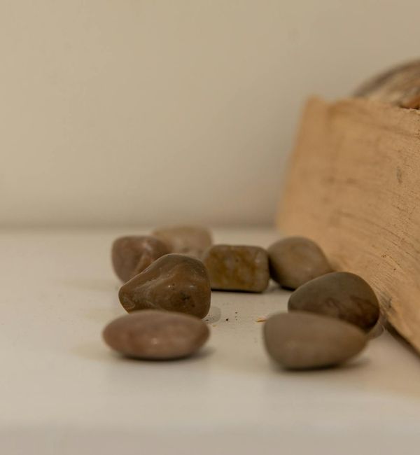 Balanced stones on a serene background, symbolizing harmony.